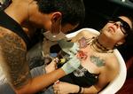 Tatovering. Den thailandske kulturminister er muligvis på vej med forbud mod, at turister får tatoveringer med hellige symboler. Arkivfoto 