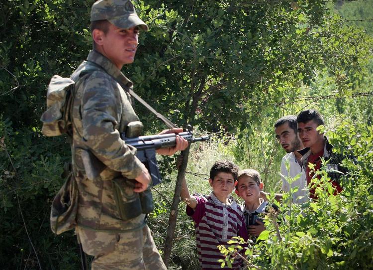 Turkish activists say Turkish soldiers have helped by cutting border fences. 