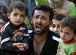 Flugt. Tusindvis af syrere er flygtet over grænsen til Tyrkiet. Mange har berettet om drab og arrestationer udført af syriske sikkerhedsstyrker med hjælp fra iranske militsfolk. 