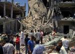 Ruiner. Det libyske regime fremviser resterne af det lejlighedsbyggeri, som blev ramt af Natos bomber. Ni døde angiveligt, deraf to børn. 