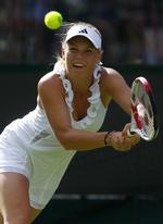 Vinder. »Vinden kom meget i stød og fløj rundt på banen. Så det gjorde det hele lidt svært«, siger Wozniacki. 