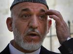Tilfreds. Hamid Karzai siger, at det afghanske f olk tillid til Afghanistans hær og politi stiger dag for dag, og ser derfor med fortrøstning frem til, at amerikanerne begynder at trække deres soldater hjem. 