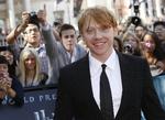 Rupert Grint med et stort smil i London. 
