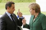 BERLIN. Sarkozy og Merkel fra Europas stærkeste land indledte i aftes et møde, hvor de skulle forsøge at finde en fælles aftale. 