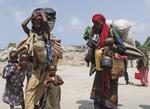 Desperate. Somaliske kvinder bærer deres børn og ejendele fra det sydlige Somalia på vej mod flygtningelejre i hovedstaden Mogadishu. Foto: Farah Abdi Warsameh 