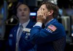 Kursfald. En aktiehandler på New Yorks fondsbørs på Wall Street reagerer på de største kursfald på en enkelt dag siden finanskrisen i 2008. 