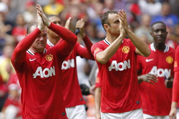 forståligt. Klubkammeraterne Wayne Rooney (t.v.) og Rio Ferdinand (i baggrunden) er enige i, at onsdagens landskamp mod Holland skulle aflyses. 