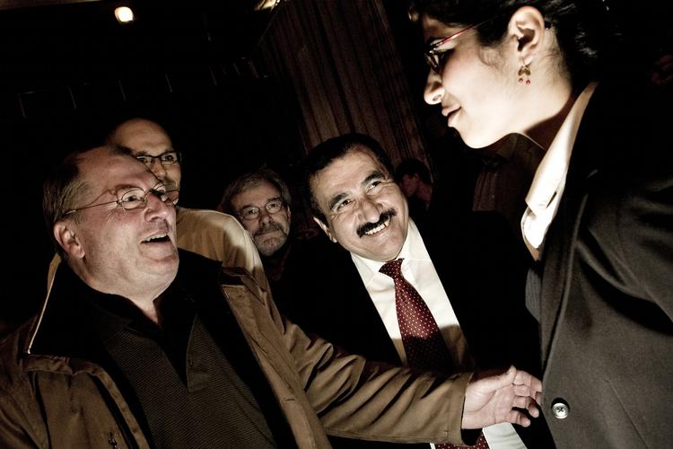 A happy Hüseyin Arac (centre) says his Ramadan reception in Parliament is to go ahead. Archive. 