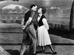FILMFLIRT. Gene Kelly og Leslie Caron i nærkontakt. Fra filmen 'En amerikaner i Paris'. 