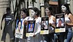 Protest. Krænkelser af kvinder er et stort problem i Colombia, skriver Amnesty International i ny rapport. På billedet demonstrerer aktivister for de mange mennesker, der hvert år forsvinder i landet. 