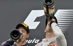 skål. Både dagens vinder, Jenson Button (th), og nummer to, Sebastian Vettel, havde grund til at fejre dagens resultat efter grand prix'et i Ungarn. 