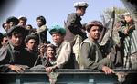2008: Soldater, der er loyale overfor krigsherren Abdul Rashid Dostum, trækker sig fra en frontposition i Mazar-e-Sharif i det nordlige Afghanistan. Lederne har nu godkendt den nye forfatning, men rester af den afsatte Taleban-milits og private småhære styret af afhoppede krigsherrer hærger stadig landet og truer med at ødelægge det valg, der skal afholdes næste år. 