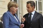 Håndslag. De to mægtigste regeringsledere i Europa, Angela Merkel og Nicolas Sarkozy, har lagt en plan før weekendens topmøde. 
