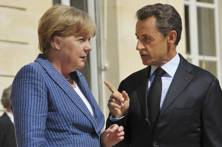 Håndslag. De to mægtigste regeringsledere i Europa, Angela Merkel og Nicolas Sarkozy, har lagt en plan før weekendens topmøde. 