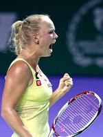 COMEON! Caroline Wozniackis fightervilje bar hende frem til sejren over Agnieszka Radwanska. 