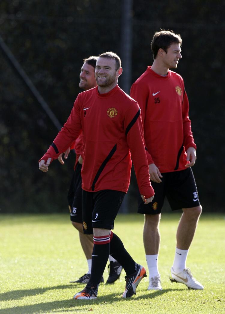 træning. Wayne Rooney (midt) kommer sandsynligvis i startopstillingen, når Manchester United onsdag møder Otelul Galati. 