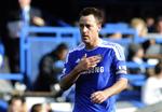 Racist? John Terry, der i aftes sad på bænken i Belgien, fik støtte fra de 1.100 medrejsende Chelsea-fans, der sang 'Anton Ferdinand, You know what You are', hvilket fik Chelsea-ledelsen til at fordømme tilskuerne på det kraftigste. 