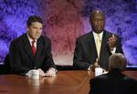 KAMPHANER. Herman Cain (th) og Rick Perry (tv) kæmper om at blive republikanernes udfordrer til Barack Obama. 