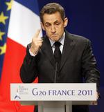 Glædeligt. Nicolas Sarkozy glædede sig især over, at grækerne har opgivet at sende den økonomiske redningsplan til folkeafstemning. 