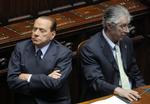 Rygter. Silvio Berlusconi (TV) har ingen planer om at gå af, siger han forud for kritisk afstemning i morgen og vedholdende rygter om hans afgang. 