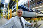 Archive picture of DSB Director Frank Olesen in maintenance and repair sheds, with IC4 in the background. 