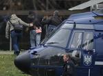 Terrorsag. Udover de tre, der formodes at stå bag mordene på ni indvandrere og en politibetjent, anholdt politiet i går en fjerde person. Han er mistænkt for at hjælpe gerningsmændene med blandt andet falske pas og kørekort. 