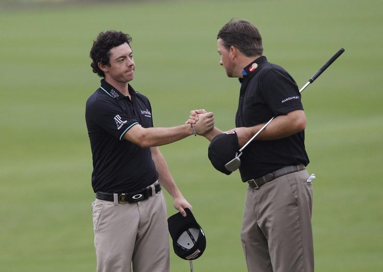 Top. Graeme McDowell og  Rory McIlroy (t.v.) gik med fire slag under par dagens bedste runde på Hainan Island. 