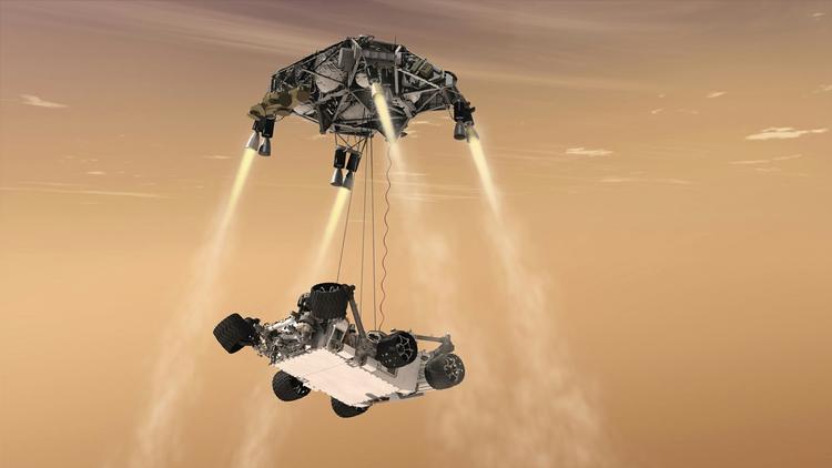 Mars-bilen 'Curiosity' skal lede efter spor af liv på Mars. Den skal sænkes ned på den røde planets overflade ved hjælp af faldskærme og et særligt kransystem. 