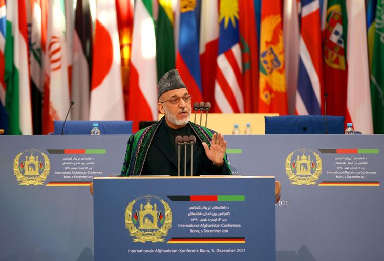 Den afghanske præsident sagde til de mere end 1.000 delegerede, at hand regering vil bekæmpe korruption og tilstræbe nationale forsoning 