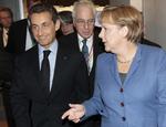 Hovedpersoner. Frankrigs præsident Nicolas Sarkozy den tyske kansler Angela Merkel kommer til at spille en afgørende rolle på dagens EU-topmøde, der kan blive historisk. 