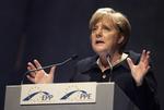 jernlady. Angela Merkel visualiserer her fint, hvor stor en nedtur, gældskrisen har været. 