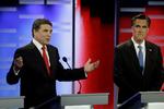 DEBAT. Rick Perry og Mitt Romney (t.h.) under debatten mellem de republikanske præsidentkandidater i Des Moines i Iowa, hvor Romneys væddelyst vakte opsigt. 