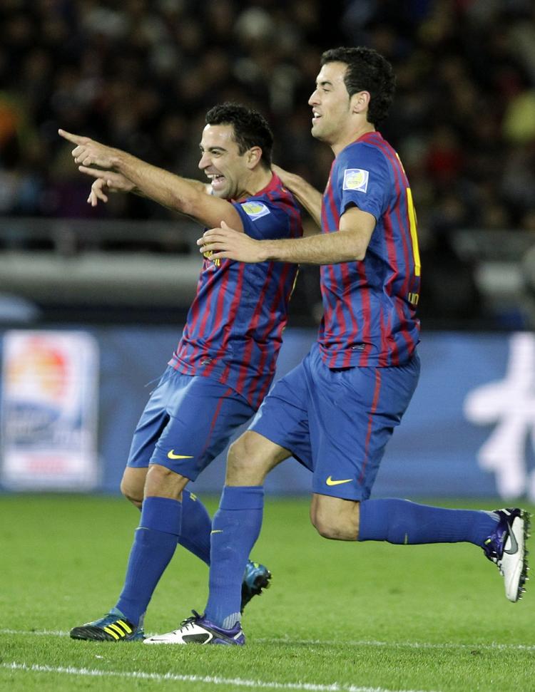 Eneren. Xavi (t.v.) er nærmest uerstattelig, mener Olsen, og siger, at det er på tide, at den snart 32-årige Barcelona-spiller får tildelt den prestigefyldte hæder. 