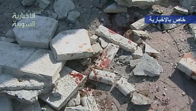 Selvmordsbomber. Syrisk stats-tv raporterede om bombeangrebene, som Assad-styret mener er opørernes værk. 