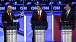 Dyst. Tre af de syv kandidater - Paul, Perry og Romney - ses under en af de sidste tv-debatter 