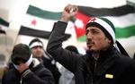 Aftale. De syriske oprørere, her ved en demonstration i Jordan, vil have en mere struktureret organisation i kampen mod styret i Damaskus. 