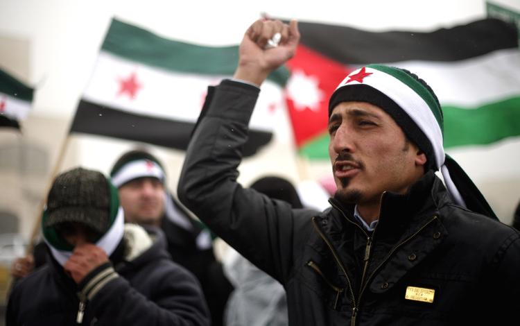 Aftale. De syriske oprørere, her ved en demonstration i Jordan, vil have en mere struktureret organisation i kampen mod styret i Damaskus. 