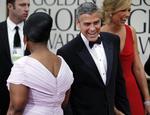 Vinder. 'The Descendants' er ifølge Golden Globes årets bedste film. her ankommer filmens hovedrolleindehaver George Clooney til prisuddelingerne i Los Angeles søndag. 