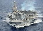 Magtdemonstration. 'USS Abraham Lincoln' fotograferet i december. I går sejlede det gennem Hormuzstrædet, som Iran har truet med at lukke. Strædet er vitalt for Vesten, da 17 procent af verdens olietransport foregår gennem strædet. 