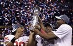 Sejr. Victor Cruz (til venstre) og de øvrige New York Giants-stjerner kunne juble, da en hård sæson kulminerede med det ultimative trofæ. 
