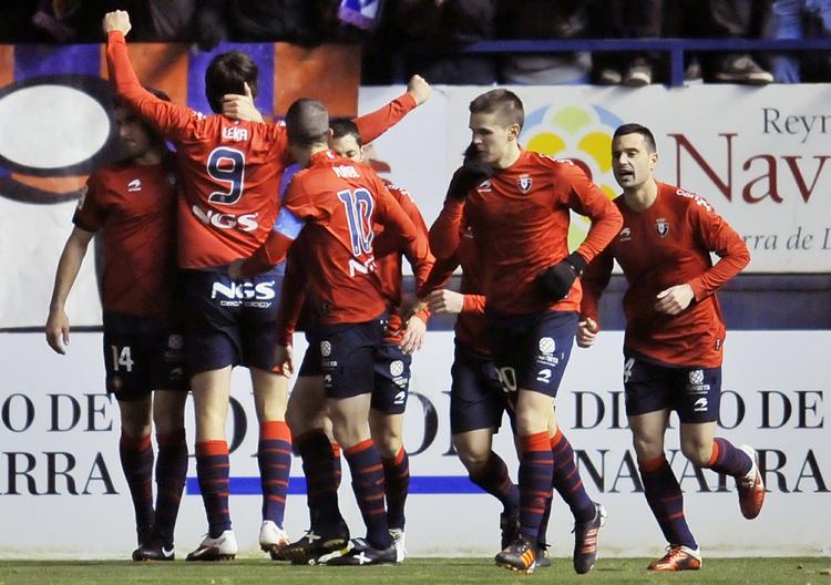 Glæde. Osasuna-spillerne jubler over sejren mod Barcelona. 