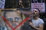 udbredt. Modstanden mod Syriens præsident, Assad, har bredt sig uden for landets grænser. Billedet er fra i lørdags foran Syriens ambassade i London. 