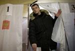En af Vladimir Putins udfordrere var mangemillionæren Mikhail Prokhorov, der her stemmer i Krasnojarsk. 