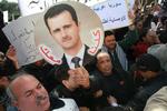 Støtte. Det syriske oprør har vakt opmærksomhed langt ud over Syriens grænser. Her demonstrerer folk i Tunesien til fordel for Bashar al-Assad, der ses på skiltet. 