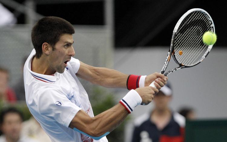 Farvel. Novak Djokovic er som mange andre meget lidt begejstret for det blå grus i Madrid. 