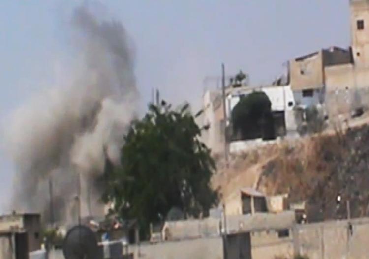 URO. Dette billede er sluppet ud fra Syrien og forestiller angiveligt røg fra bygninger i provinsen Homs. 