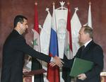 Handelspartnere. Ruslands præsident Vladimir Putin og Syriens Bashar Assad under møde i 2005. 