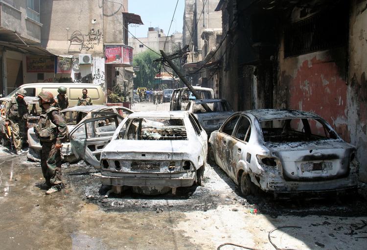 Slutspil. Siruationen i Syrien kan ende med alt fra et blodigt kaos à la Irak til en forhandlet løsning à la Yemen, skriver Politikens udlandsredaktør. Billedet her stammer fra en pressetur arrangeret af den syriske regering og viser syriske soldater efter de har genvundet kontrollen over Midan-distriktet i den sydlige del af hovedstaden Damaskus. 