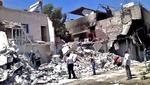 kampe. Dette billede fra Ugarit News viser konsekvensen af bombardementer i distriktitet al-Qadam i Damaskus, men billedet kan ikke verificeres. 