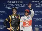 pole. Lewis Hamilton (th) havde den bedste tid og indleder grandprix'et i Ungarn fra spids. Romain Grosjean (tv) blev nummer to i tidskørslen. 